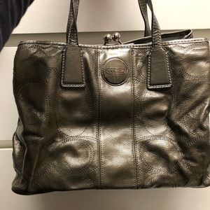 Coach silver bag with snap closure